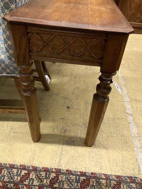 A Victorian Gothic style oak side table with drawer, width 111cm, depth 41cm, height 67cm (cut down)